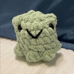 Handmade crocheted frog plushie — cute and cuddly